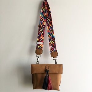 Purse with eclectic, interchangeable strap.